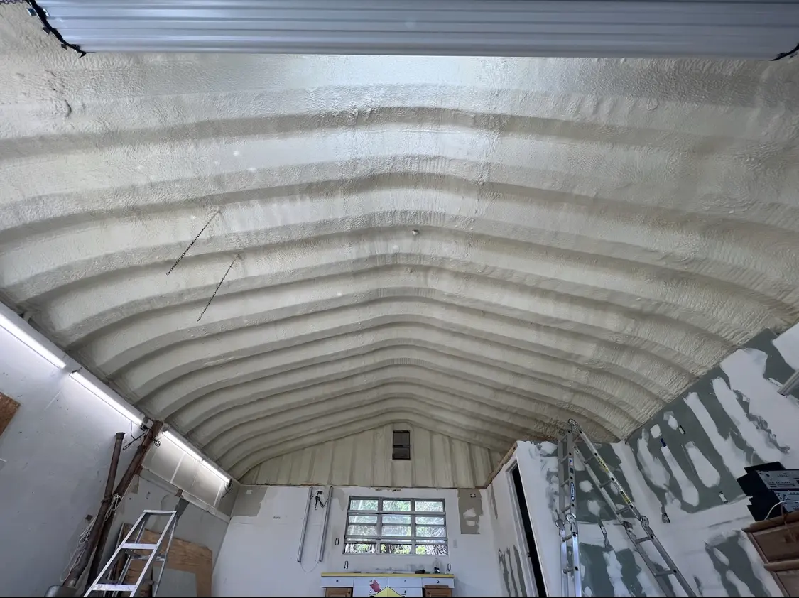 Spray polyurethane foam applied to the underside of a metal roof deck in Palm Beach Gardens